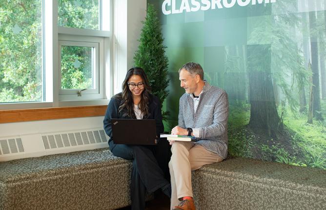 Faculty research Two people sitting by a window