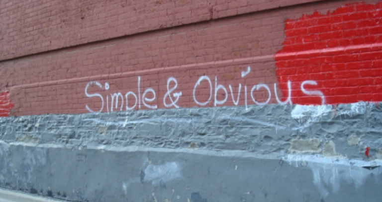 Graffiti that says "Simple and obvious"