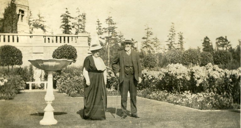 Archival photo of two people in garden